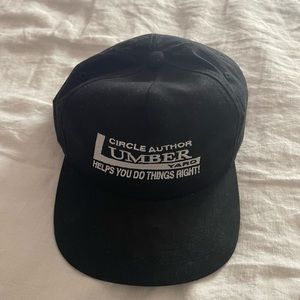 Circle Author Lumber Yard Unstructured Black Snapback Hat